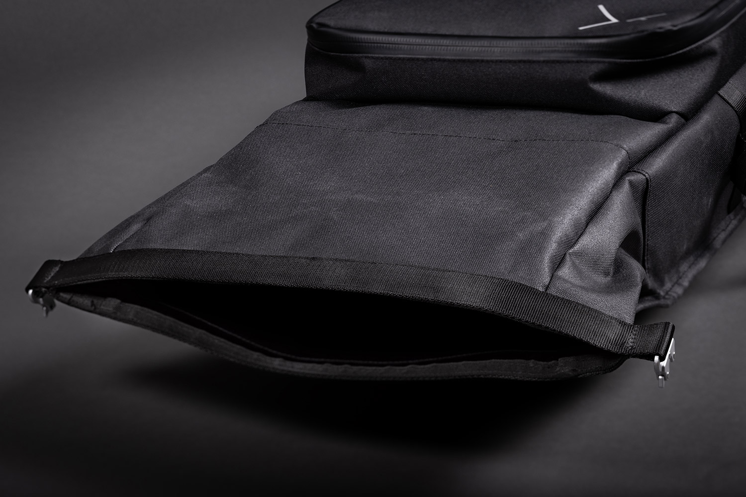 Close-up view of the main compartment opening of the Helix Stadium Backpack