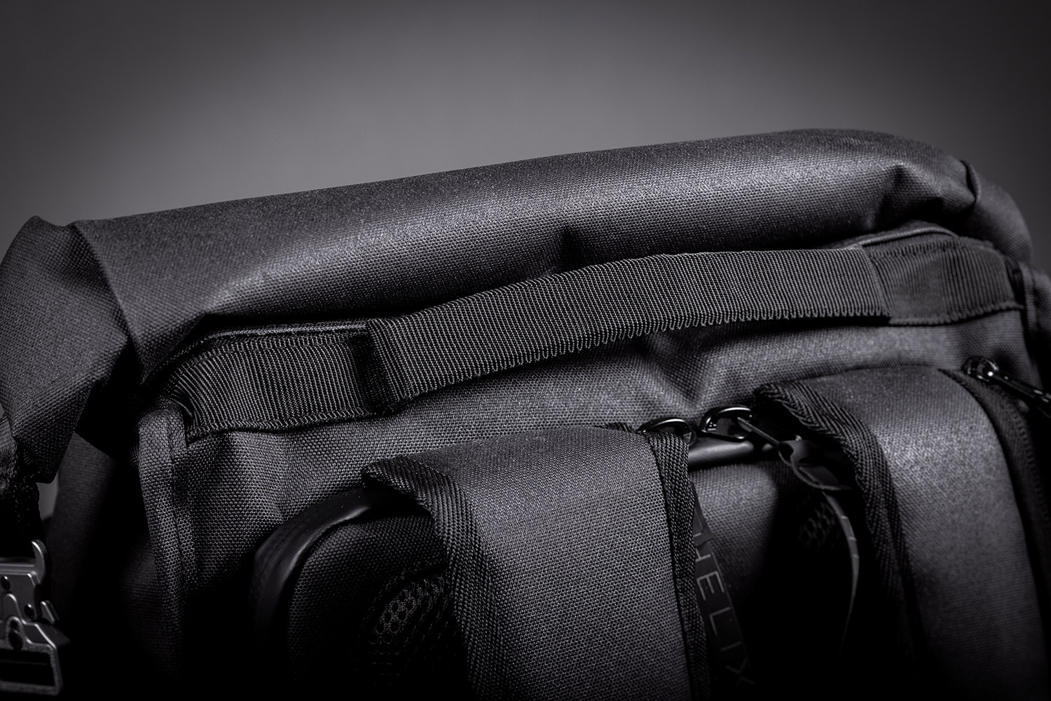 Close-up view of the top handle of the Helix Stadium Backpack